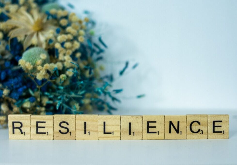 photo of Scrabble letters that spell "resilience"